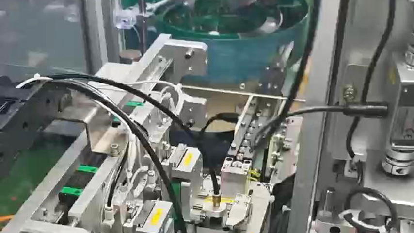 Automatic assembly line for automotive damper components